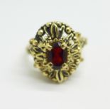 A 14k gold and garnet ring, 4.8g, N