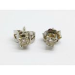 A pair of 14ct white gold and diamond earrings