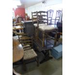 An oak drop leaf table and four ladderback chairs