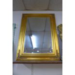 A Victorian style gilt framed mirror