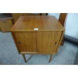 A teak two door record cabinet