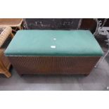 A Lloyd Loom wicker ottoman