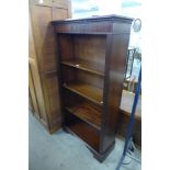 A mahogany open bookcase