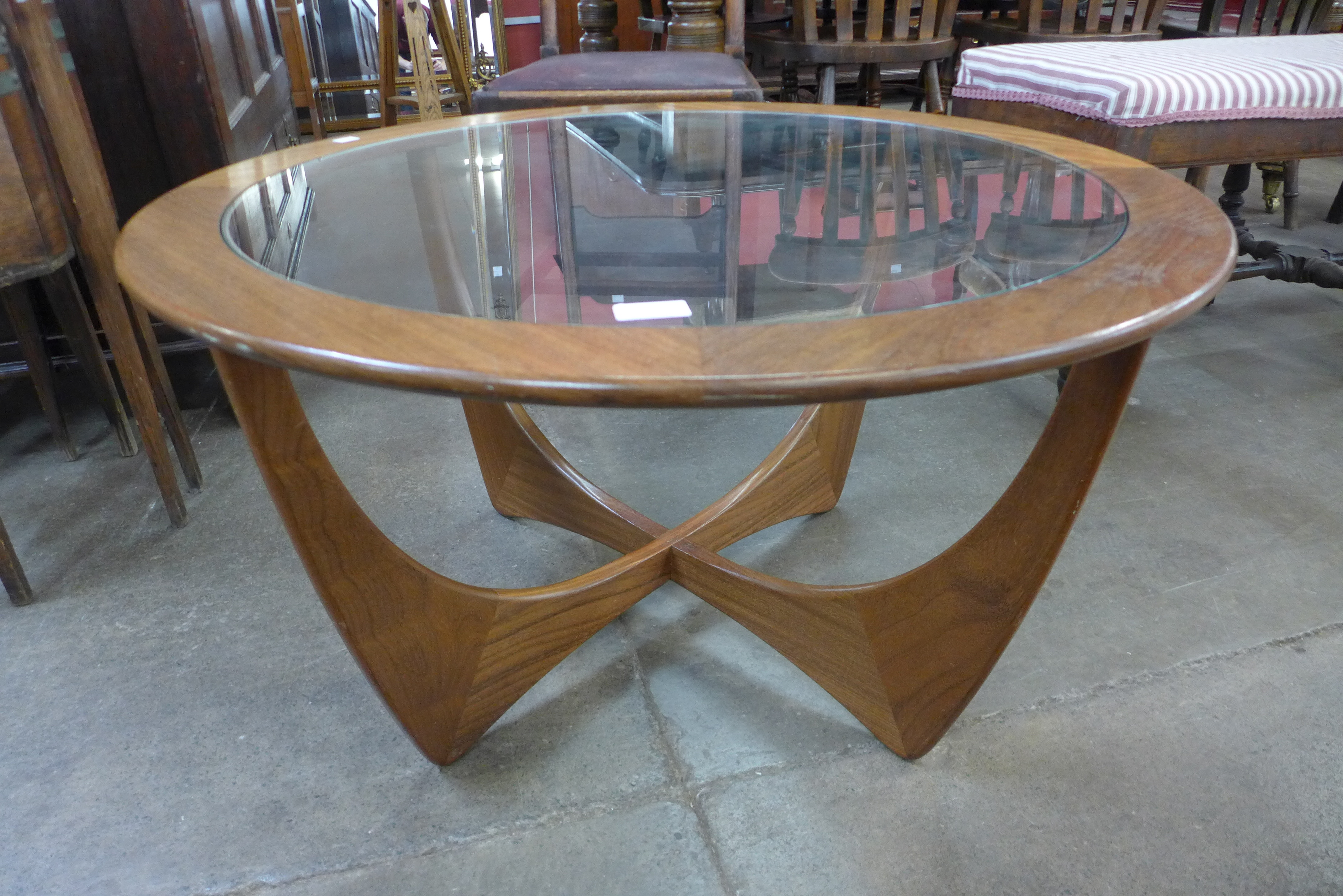 A G-Plan Astro teak and glass topped circular coffee table