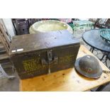 An ammunition box and a WWII British military helmet