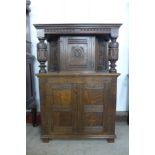 A 17th Century style carved oak dwarf court cupboard, signed J. Wallace, 123cms h, 84cms w, 38cms d