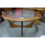 A G-Plan Astro teak and glass topped circular coffee table