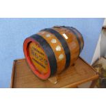 A coopered oak barrel with silver shield mounts