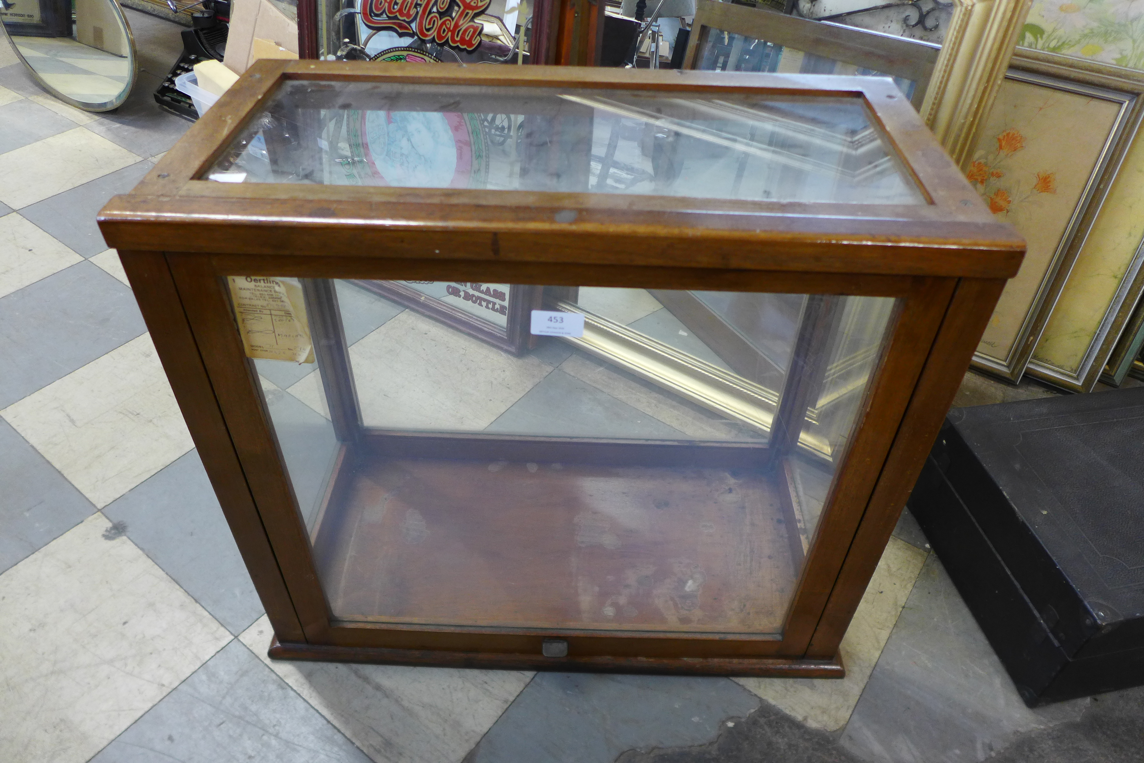 An oak table top display cabinet