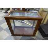 An oak table top display cabinet