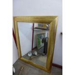 A large gilt framed mirror