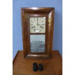 A 19th Century American mahogany ogee wall clock, by Chauncey Jerome