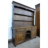 An 18th Century style oak dwarf dresser, 170cms h, 137cms w, 36cms d