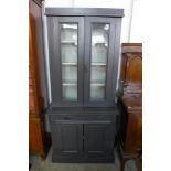 A Victorian style painted four door bookcase