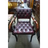 A Regency style mahogany and red leather elbow chair