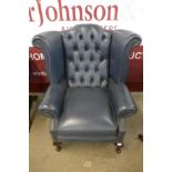 A Chesterfield blue leather wingback armchair