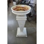 A cast iron garden bird bath