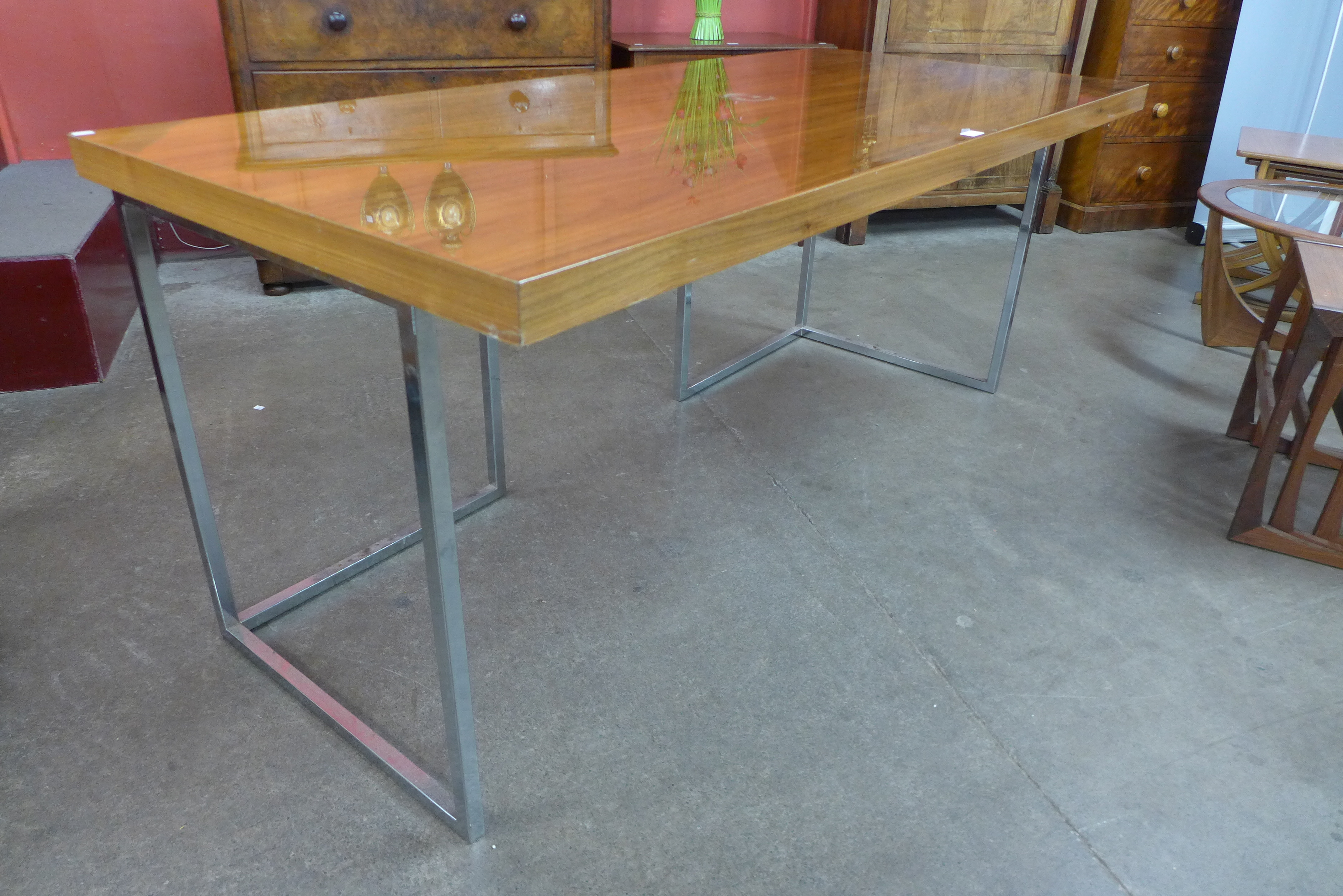 A walnut and chrome desk