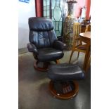A beech and brown leather swivel reclining armchair and matching stool