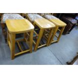A set of three beech stools