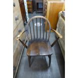 An Ercol dark Winsdor elbow chair