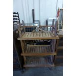 A hardwood three tier bookcase