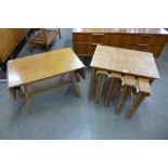 A teak nest of tables and a stool