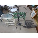 Three wrought iron stands and a fire grate