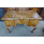 A George I style walnut three drawer side table