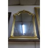 A gilt framed mirror