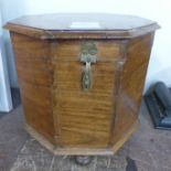 An eastern hardwood octagonal casket