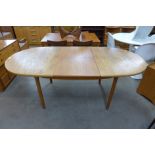 A Mcintosh teak extending dining table