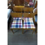 A set of four teak chairs