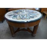 A specimen marble circular center table, on mahogany reeded base, 79cms h, 122cms d