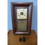 A 19th Century American mahogany weight driven ogee wall clock, by Brewster & Ingrahams