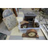 A box of assorted clock parts, including clock dials, movement, etc.
