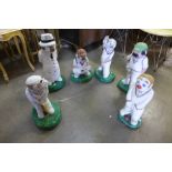 A set of six painted concrete garden figures of cricketers