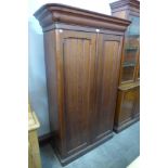 A Victorian pitch pine two door housekeepers cupboard
