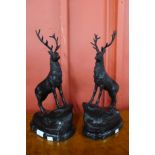 A pair of French style bronze stags, on black marble socles, 44cms h