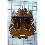 A small Italian inlaid and carved olivewood corner wall bracket