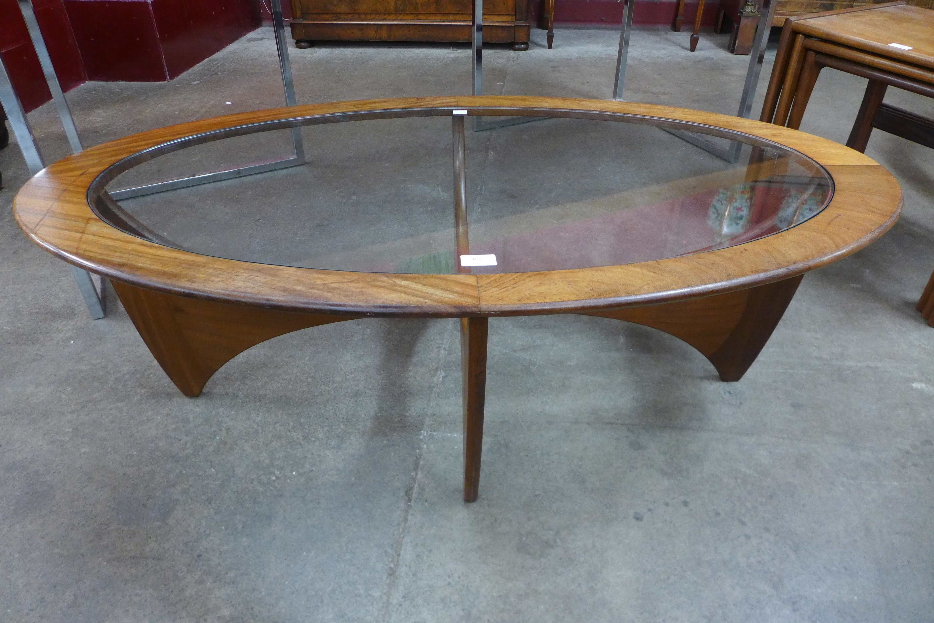 A G-Plan Astro teak and glass topped oval coffee table