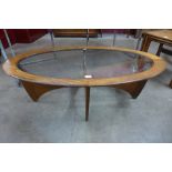 A G-Plan Astro teak and glass topped oval coffee table