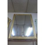 A large gilt framed mirror