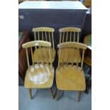 A set of four Ercol style beech kitchen chairs