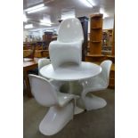 An Arkana style white laminated tulip table and four S-shaped chairs