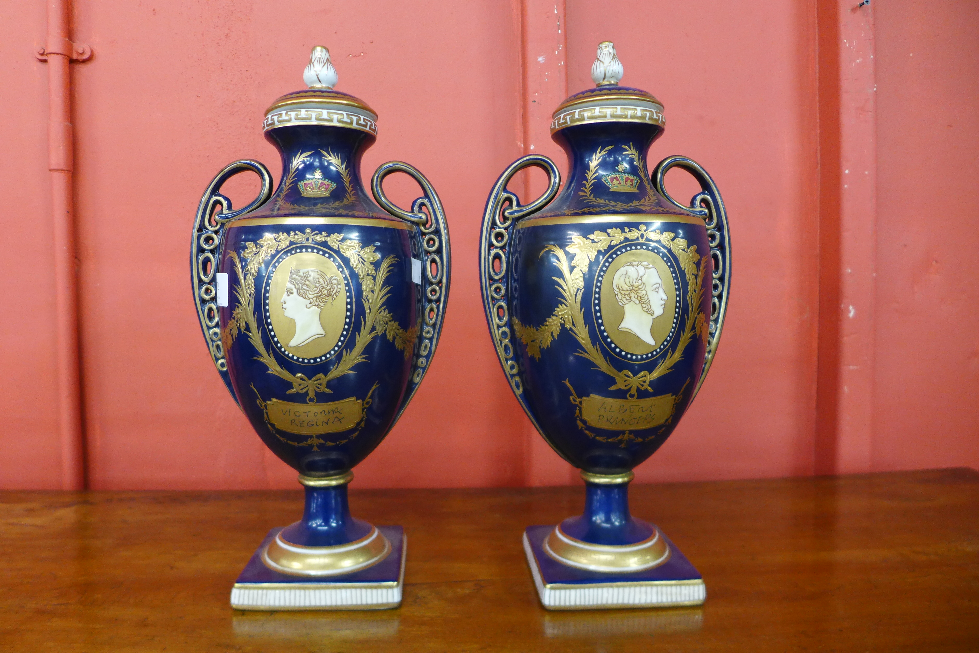 A pair of Meissen style porcelain vases and covers, depicting Queen Victorian and Prince Albert,