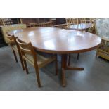 A Danish teak extending dining table and four chairs