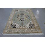 An eastern green ground silk rug, 273 x 199cms