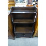 An Ercol dark open bookcase