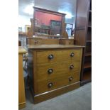 An Arts and Crafts oak dressing chest